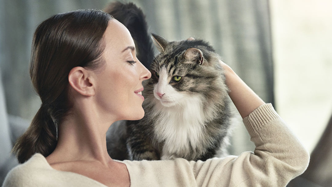 woman stroking her cat